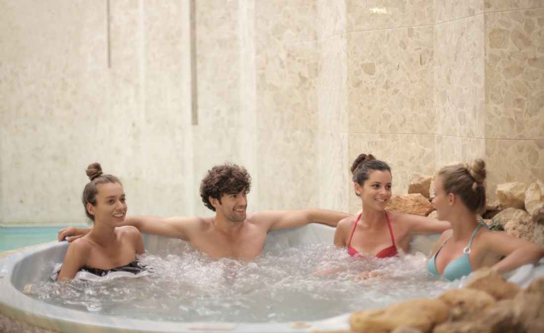 group of people in a hot tub